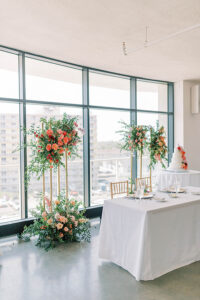 sweetheart table flowers on gold pedestals