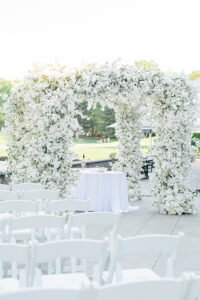 outdoor ceremony with all white flowers