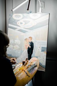 onsite wedding painter during ballroom reception