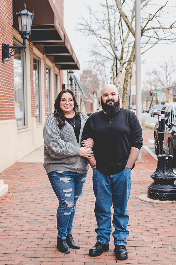 engaged couple posing in downtown Red Bank during engagement session