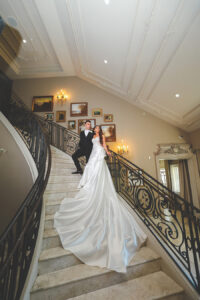 newlywed portrait on Park Chateau grand staircase