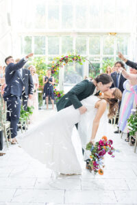 first kiss after wedding ceremony in The Madison Hotel greenhouse, Alexa Lynn Photography, Contemporary Weddings Magazine