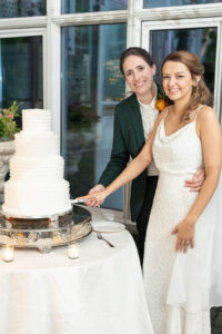 cake cutting in The Madison Hotel greenhouse, Alexa Lynn Photography, Contemporary Weddings Magazine